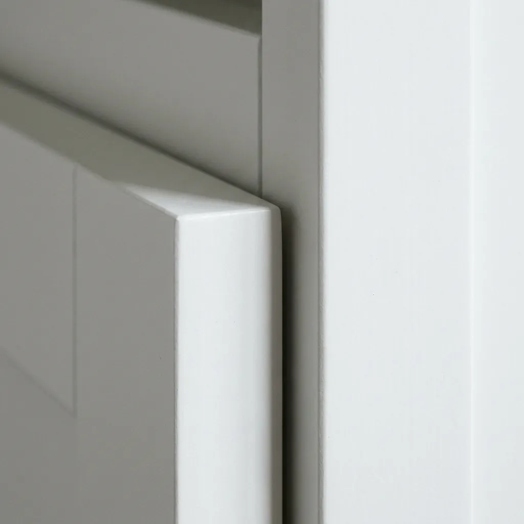 Detail of the shadow gap where a built-in wardrobe meets the ceiling.